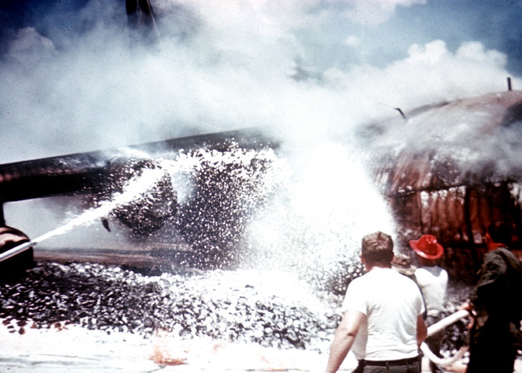 Fig. 14 - Fire crew battles the blaze.
