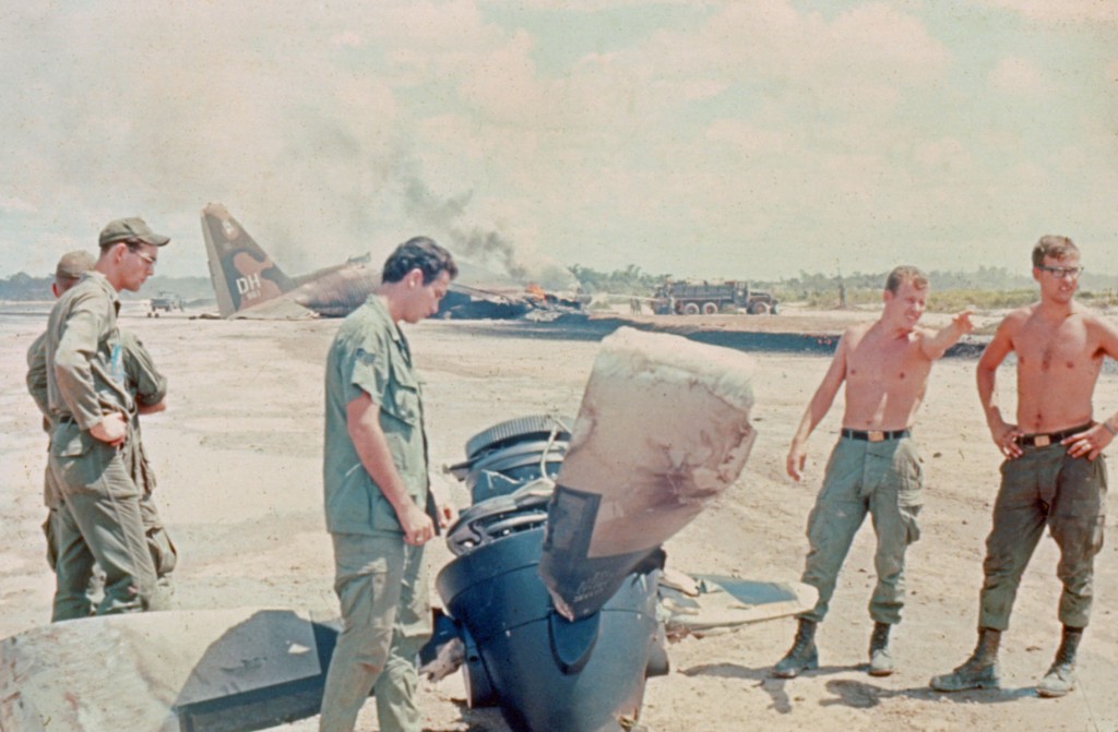Fig. 28 - This is either the #3 or #4 prop that was lost as the right wing contacted the runway.  Aircraft in the background.